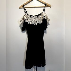 Dress with off shoulder sleeves and crochet accent